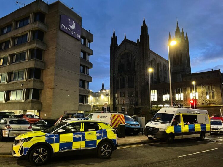 Police cars outside Premier Inn hotel in Aberdeen city centre.