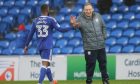Neil Warnock with Junior Hoilett during their time at Cardiff City. Image: Shutterstock.