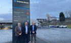 DEAL DONE: From left, ANM Group's chairman Mike Macaulay, managing director of Sweeney Kincaid Russell Kincaid, and ANM Group chief executive Grant Rogerson.