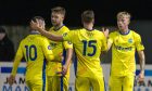 Buckie Thistle celebrate after Jack MacIver scored the first goal in their 5-1 win at Brora Rangers. Image: Jasperimage.