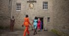 The Apprentice female contestants walking into Cawdor Castle.