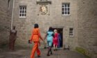 The Apprentice female contestants walking into Cawdor Castle.