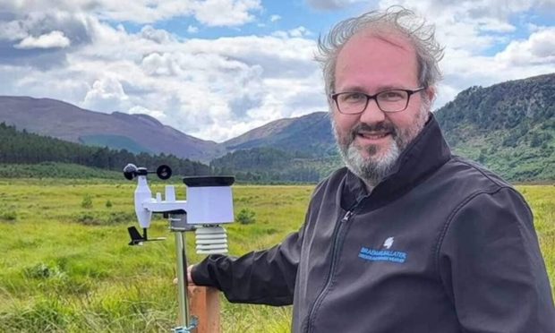 Amateur weather watcher Chris Booth of Braemar at one of his weather stations.