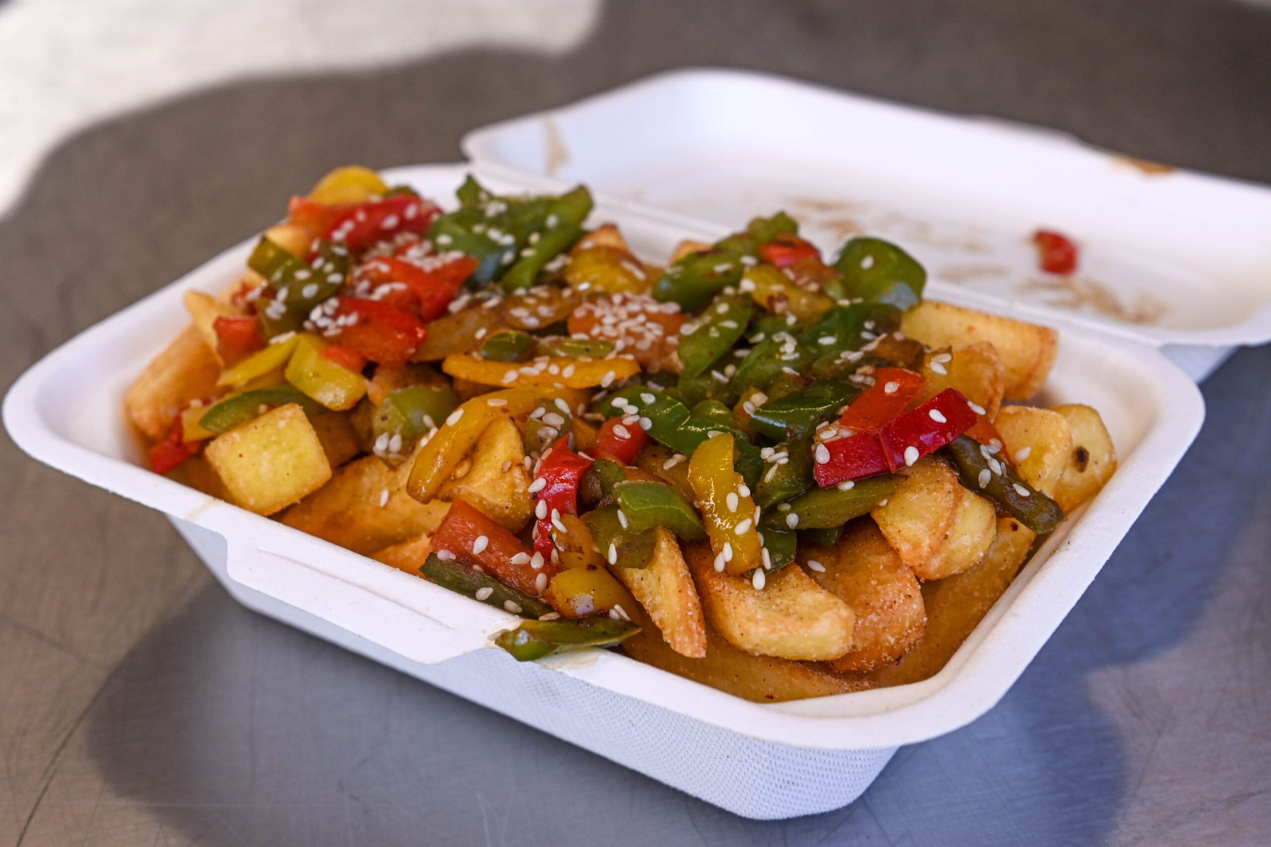 Salt and pepper chips in a takeaway box