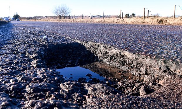 Drivers have been left furious by an "atrocious" pothole on
Wellington Road. Image: Darrell Benns/DC Thomson