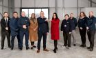 Claire Bathgate, head of sales, Dandara Aberdeen, with Steve Clark, regional sales director, Agilico, holding keys to office space at City South. They are joined here by members of the Agilico team.
