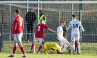 Tony Dingwall, second from right, scores Brora Rangers' opener against Deveronvale. Pictures by Jasperimage.