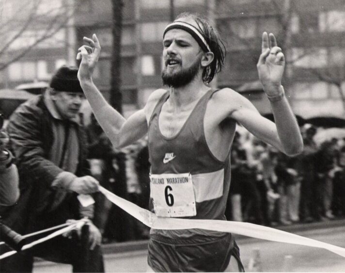 Fraser Clyne crosses the finish line of a US marathon in 1983