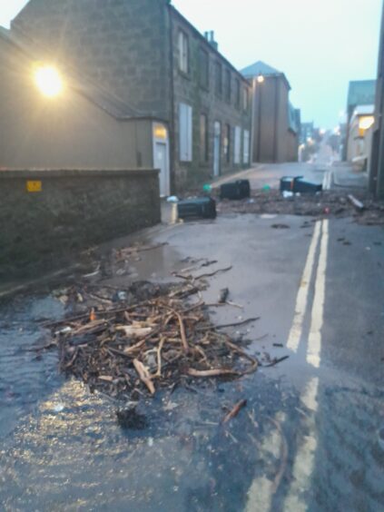 Debris has been washed up on nearby streets in Stonehaven.