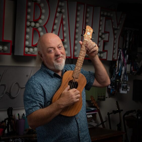 Bill Bailey playing the ukelele.