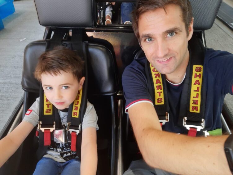 Iain McGettrick pictured with son Luke in a go-kart.