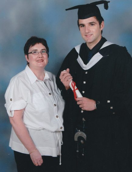 RGU student Iain McGettrick in his graduation cap and gown with his late mum Diane. 