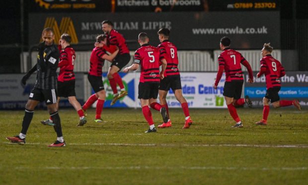 Ryan Sargent, centre, celebrates scoring for Fraserburgh against Huntly in the Evening Express Aberdeenshire Cup. Pictures by Darrell Benns/DCT Media.