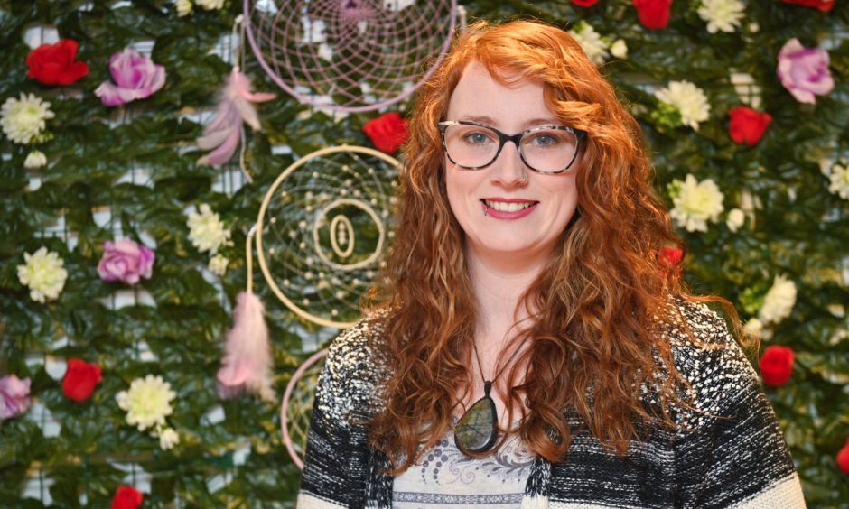 Eryne Scott inside her holistic store in Elgin