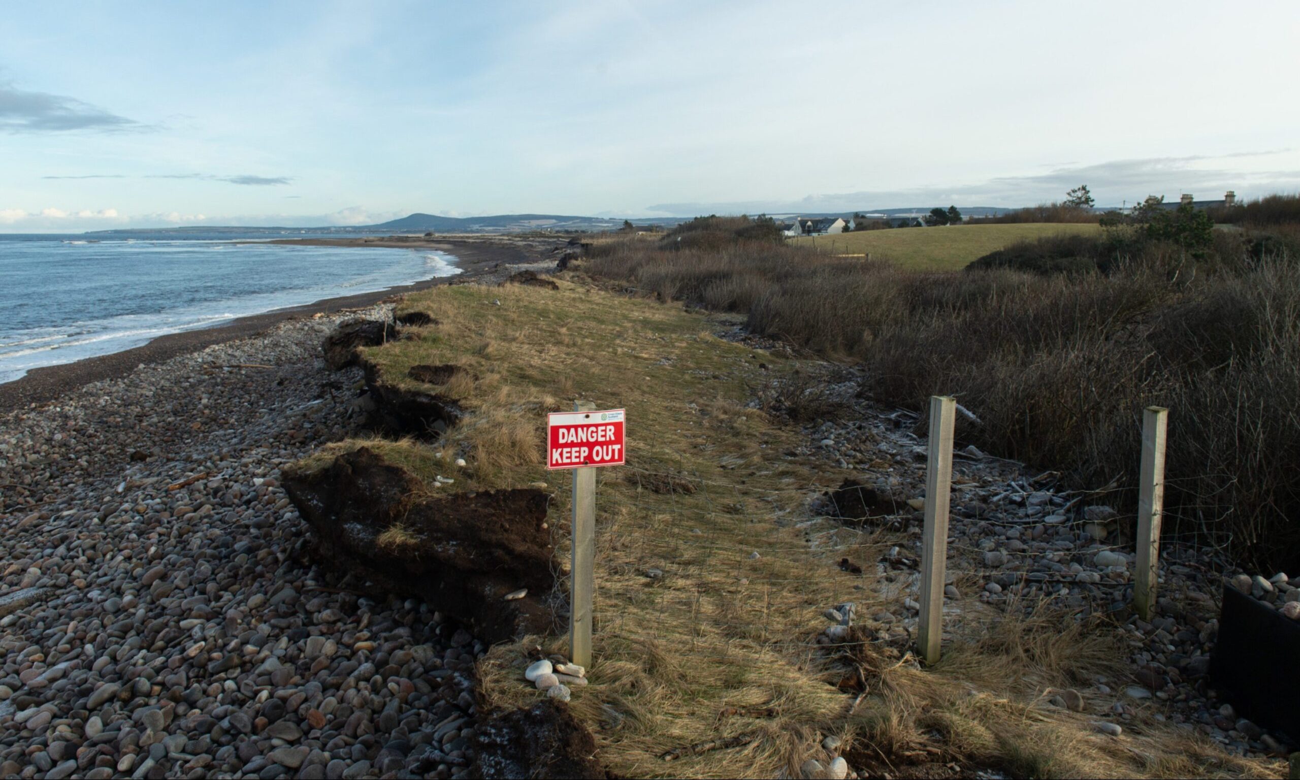 Kingston coastline with "danger keep out" sign visible. 