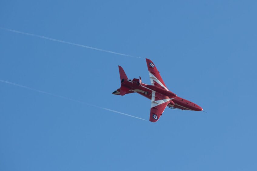 View of RAF Red arrow plane in the sky.