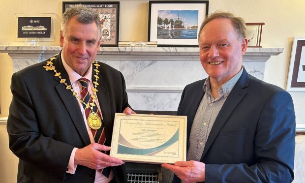 Gothenburg Great John McMaster was presented with an outstanding achievement award by Provost Drew McKenzie. 
Image: Inverclyde Council