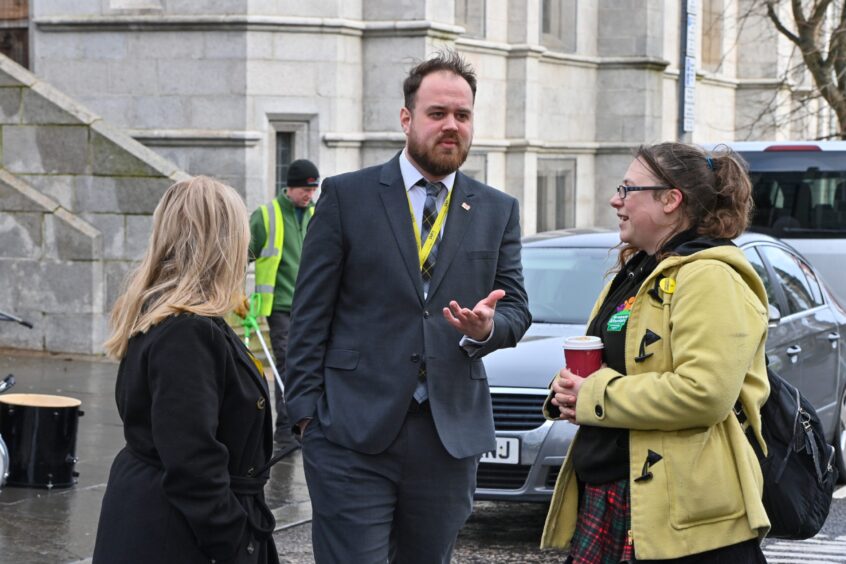 Finance convener Alex McLellan met with protestors minutes before delivering his 2023-24 budget. Image: Kenny Elrick/DC Thomson