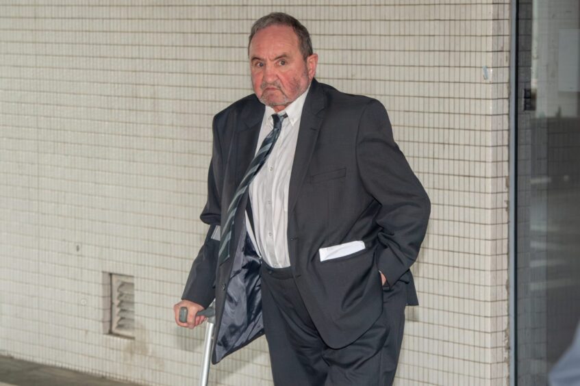 Billy McKenzie did not look pleased to be photographed by The P&J after his licensing hearing. Image: Kenny Elrick/DC Thomson