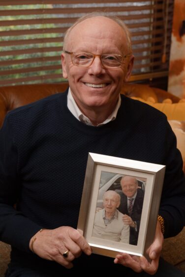 Charlie with a picture of his dad Charles, who had dementia