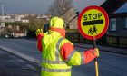 A school crossing patroller in Portlethen.