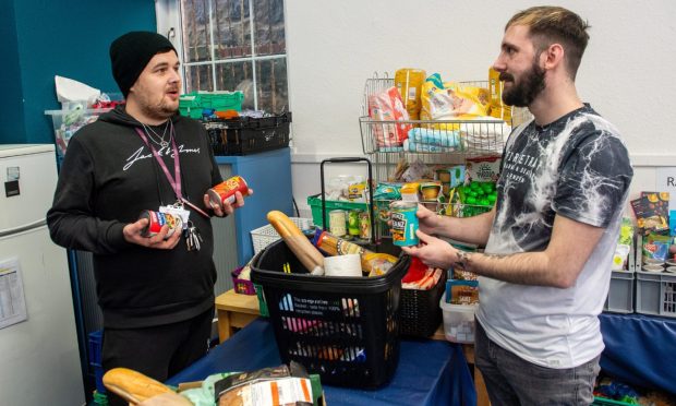 Aberdeen Cyrenians staff and volunteers oversee the charity's foodbank service.