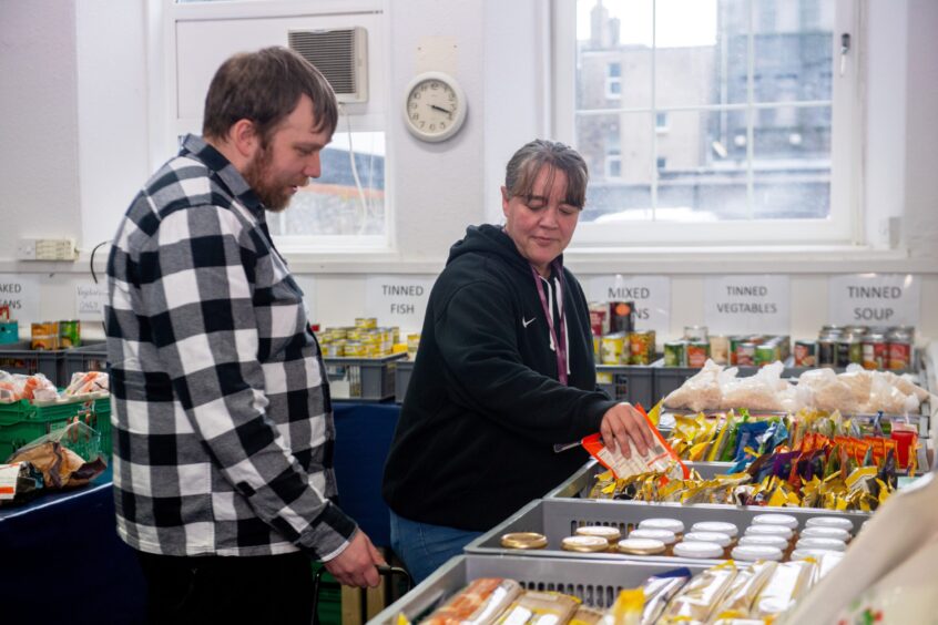 Two people in a foodbank