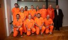 The jailbirds lined up for a photo before the fundraising got underway.