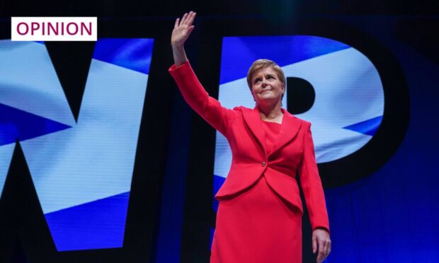 Then First Minister Nicola Sturgeon waves on stage after making her key note speech on the final day of the 2022 SNP Conference. Image: Stuart Wallace/Shutterstock