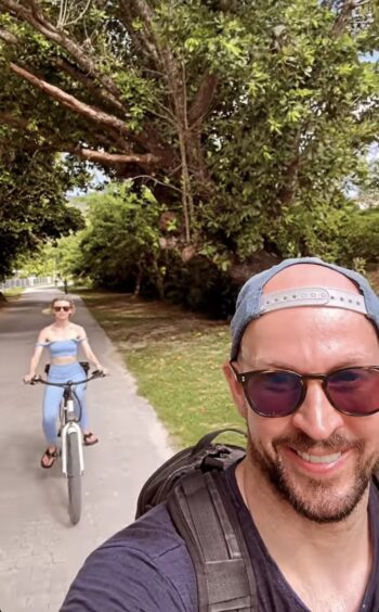 Georgia Toffolo and James Watt cycling in the Seychelles.