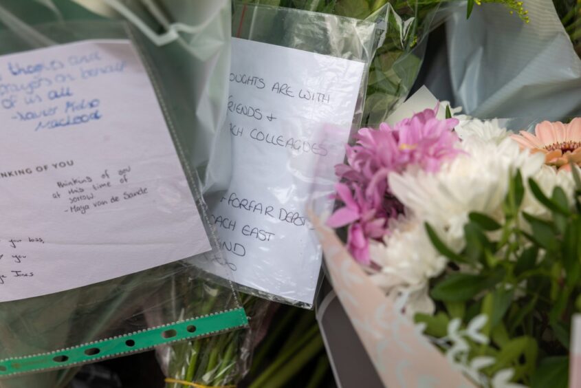 Tributes left for Keith Rollinson, the bus driver who died after being assaulted at the Elgin bus station. Image: Jasperimages