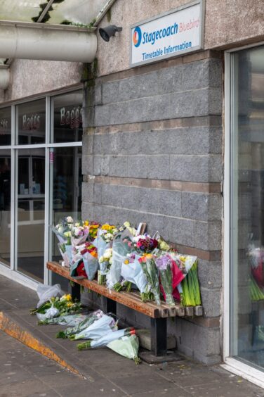 Tributes left for Keith Rollinson, the bus driver who died after being assaulted at the Elgin bus station. Image: Jasperimages