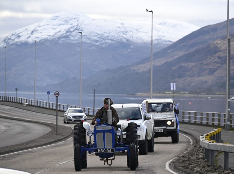 A tractor drives through Fort William as part of a protest against the Lochaber National Park. 