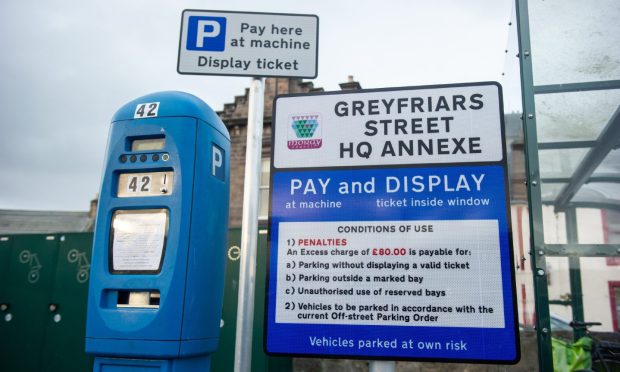 Parking pay and display machine at staff Moray Council car park.