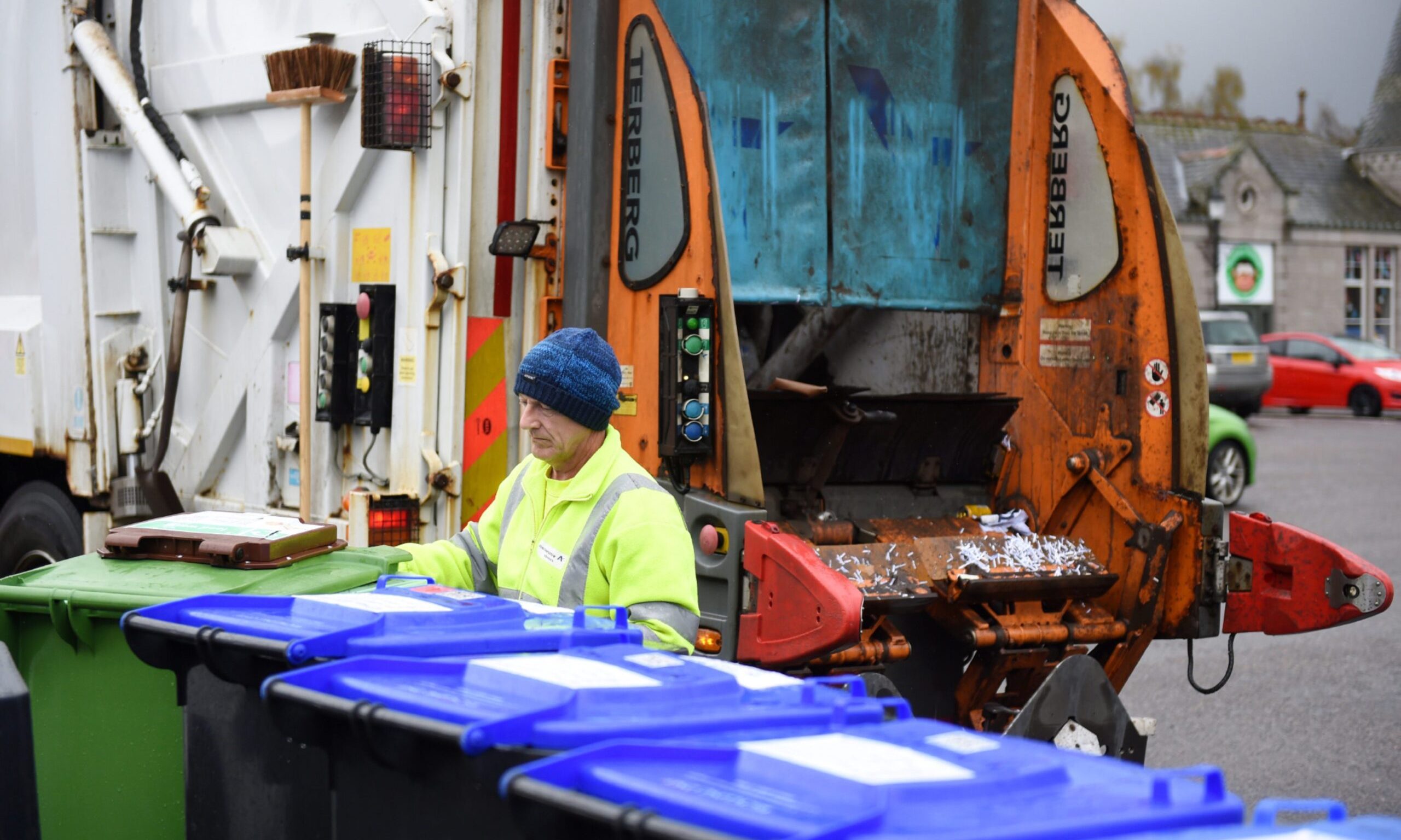 Worker on bin collection day in Aberdeenshire.