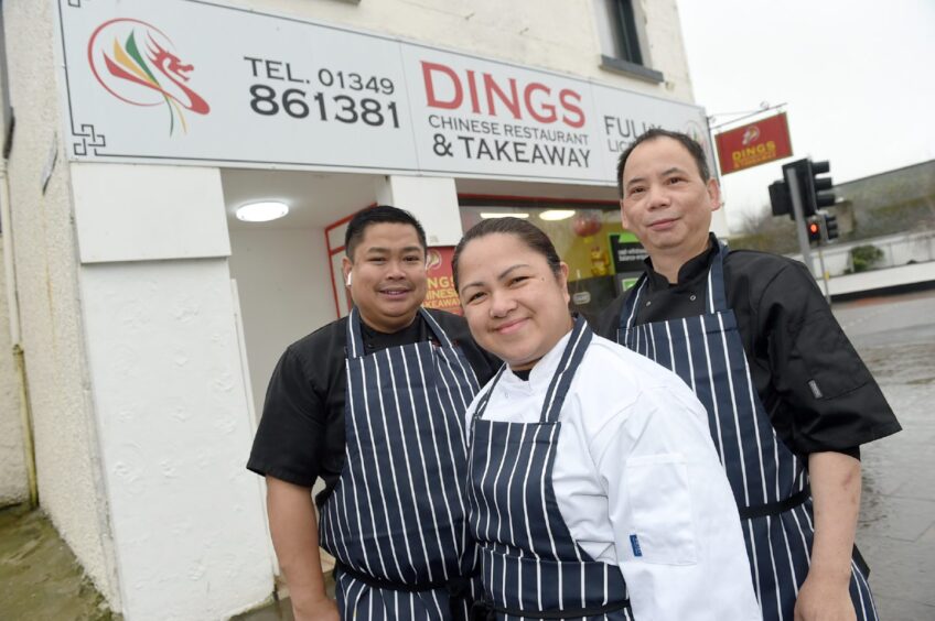 CR0046975 Alberto, Inverness Neil and Lily Aquino with on the right Ben Chan in their 'Dings' Chinese restaurant and take away in Dingwall after winning Oriental TAkeaway of the year for the North of Scotland and the overall award for Scotland. 15th February '24 Sandy McCook/DC Thomson