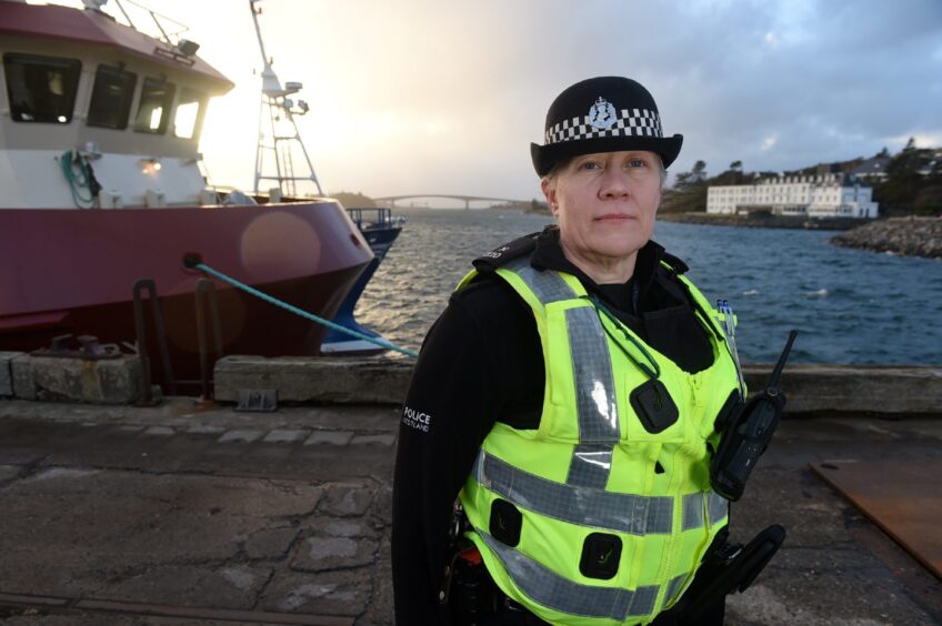 Alison MacLennan, special constable, pictured at the harbour next to a boat.