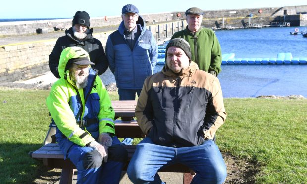 The veteran fishermen have been banned from their local harbour. Front - Michael McDonnell, Gilbert McDonnell, and back - Robert Barton, William McDonnell and Stephen Barnard. Image: Duncan Brown.