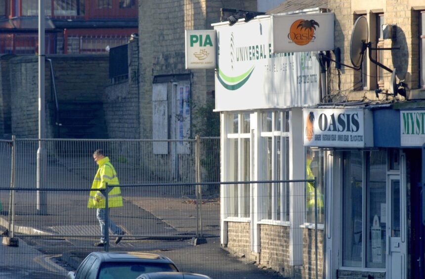 The scene of the shooting at Universal Express travel agents in Bradford.