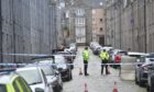 Cordon of Police in Ashvale Place in Aberdeen. The police are being strict with not allowing through people. 
24/10/2021 
Picture By Scott Baxter 
CR0031637
