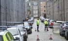 Cordon of Police in Ashvale Place in Aberdeen. The police are being strict with not allowing through people. 
24/10/2021 
Picture By Scott Baxter 
CR0031637