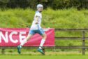 James Pringle celebrates scoring for Skye against Beauly in the Balliemore Cup final. Image: Neil Paterson.