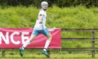 James Pringle celebrates scoring for Skye against Beauly in the Balliemore Cup final. Image: Neil Paterson.