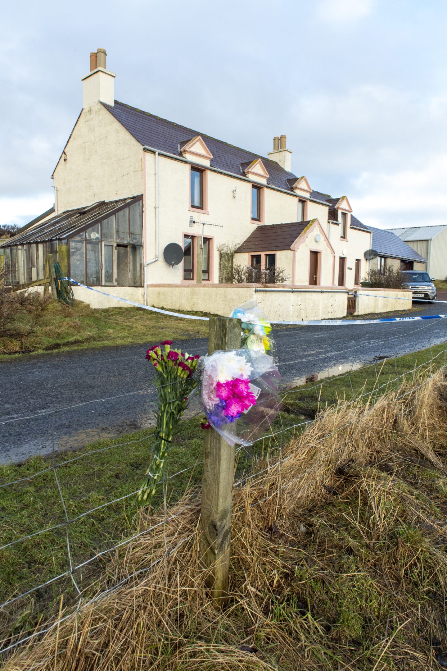 Flowers left for Claire Leveque at police cordon in Sandness, Shetland.