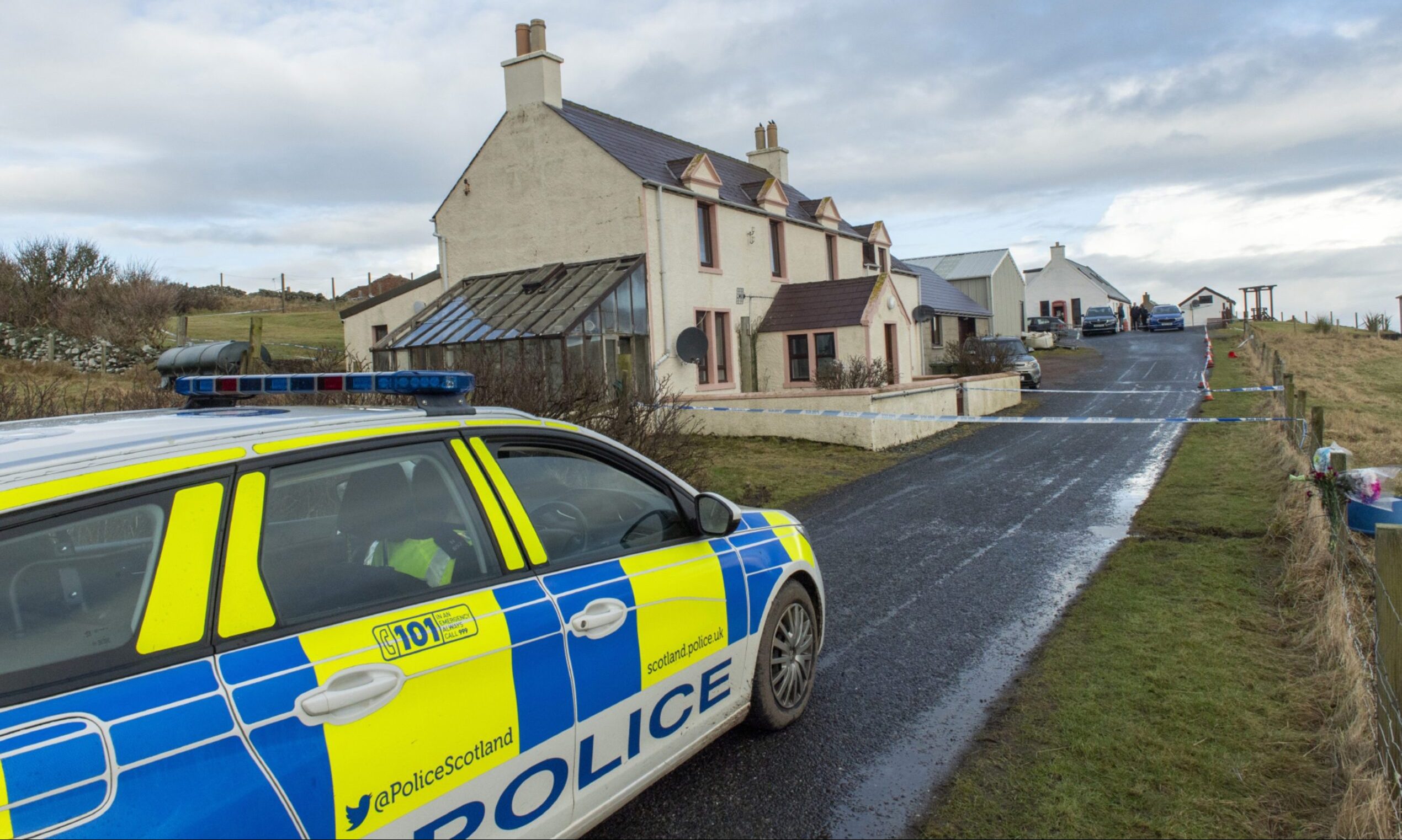 Police car at the scene of the incidents in Sandness, Shetland.