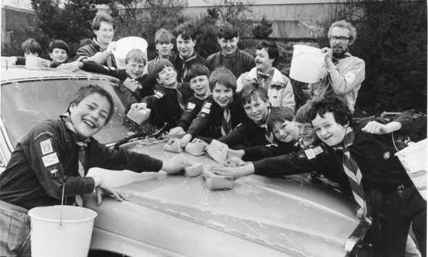 1985: Scouts of the 55th (Kincorth) Aberdeen Troop washing a car at Fine Fare's Bridge of Dee car park. They washed around 200 cars during Scout Job Week that April. Image: DC Thomson