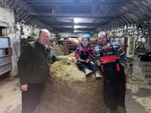 Overall winner in the Norgrass Silage competition was Stuart Ramage pictured with son Finlay and judge Alan Bradley.
