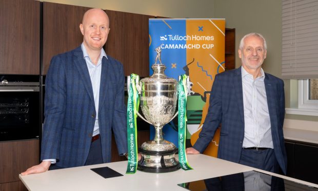 Kieran Graham, Tulloch Commercial Director, along with Sandy Grant, Tulloch Homes Managing Director, at the 2024 Camanachd Cup first and second round draw. Image: Camanachd Association.