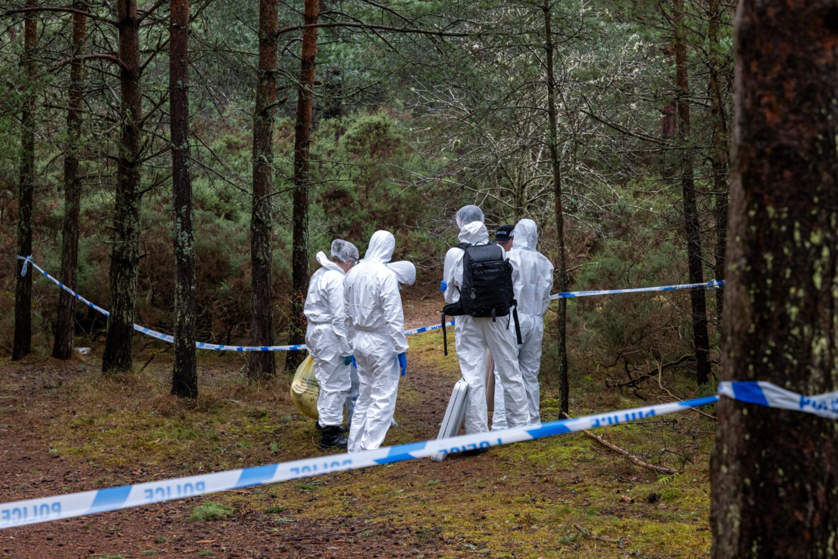 Forensics comb Lossiemouth woods after woman's body is found