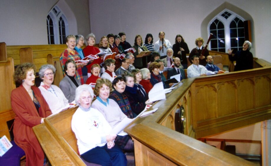 Banchory Singers exercise their vocal chords ahead of a Christmas concert in December 1994